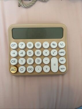 Minimalist Beige Calculator with White Keys and Gold Accent